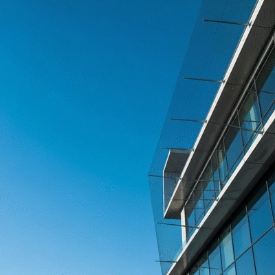 Modern building in Sheffield with bird netting installed, clear sky, no text, no words, no typography, 8K