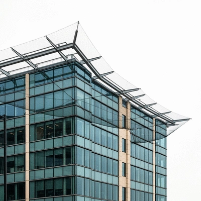 Modern urban building with bird netting and deterrents, clean image